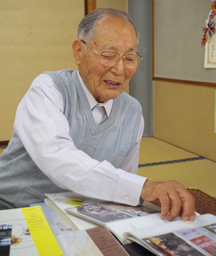 今までの取り組みを写真と共に語る 小林武司 名誉会長